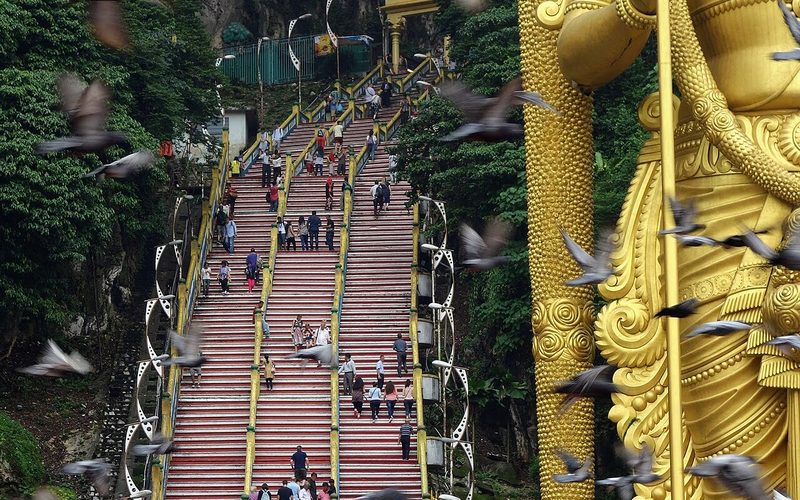 Batu Caves rainbow stairs and golden Murugan statue